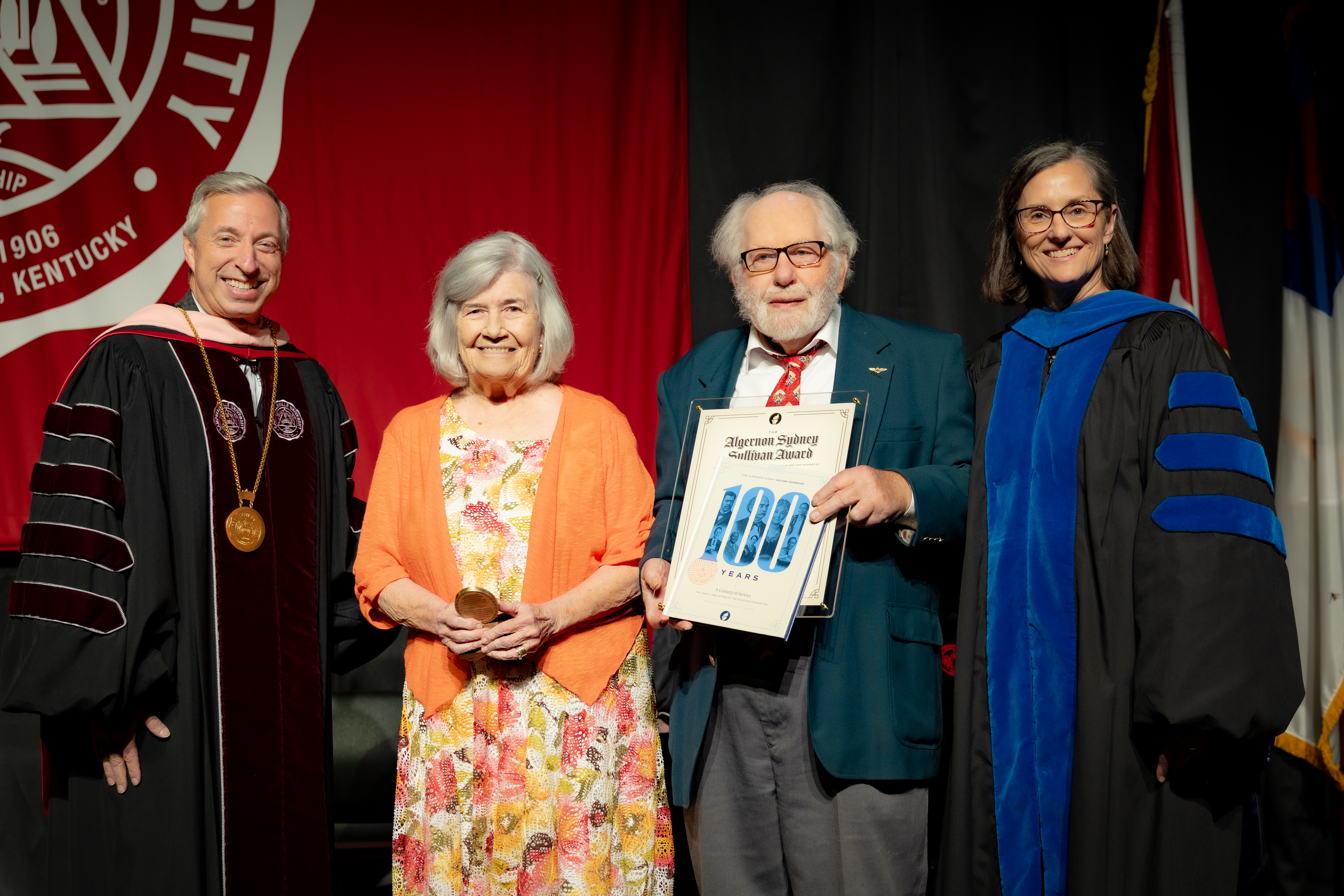 CU Alum Dan and Ginny Flanagan (Class of ’65) received the Algernon Sydney Sullivan Award from CU President Joseph Hopkins (left) and Provost Jeanette Parker (right)