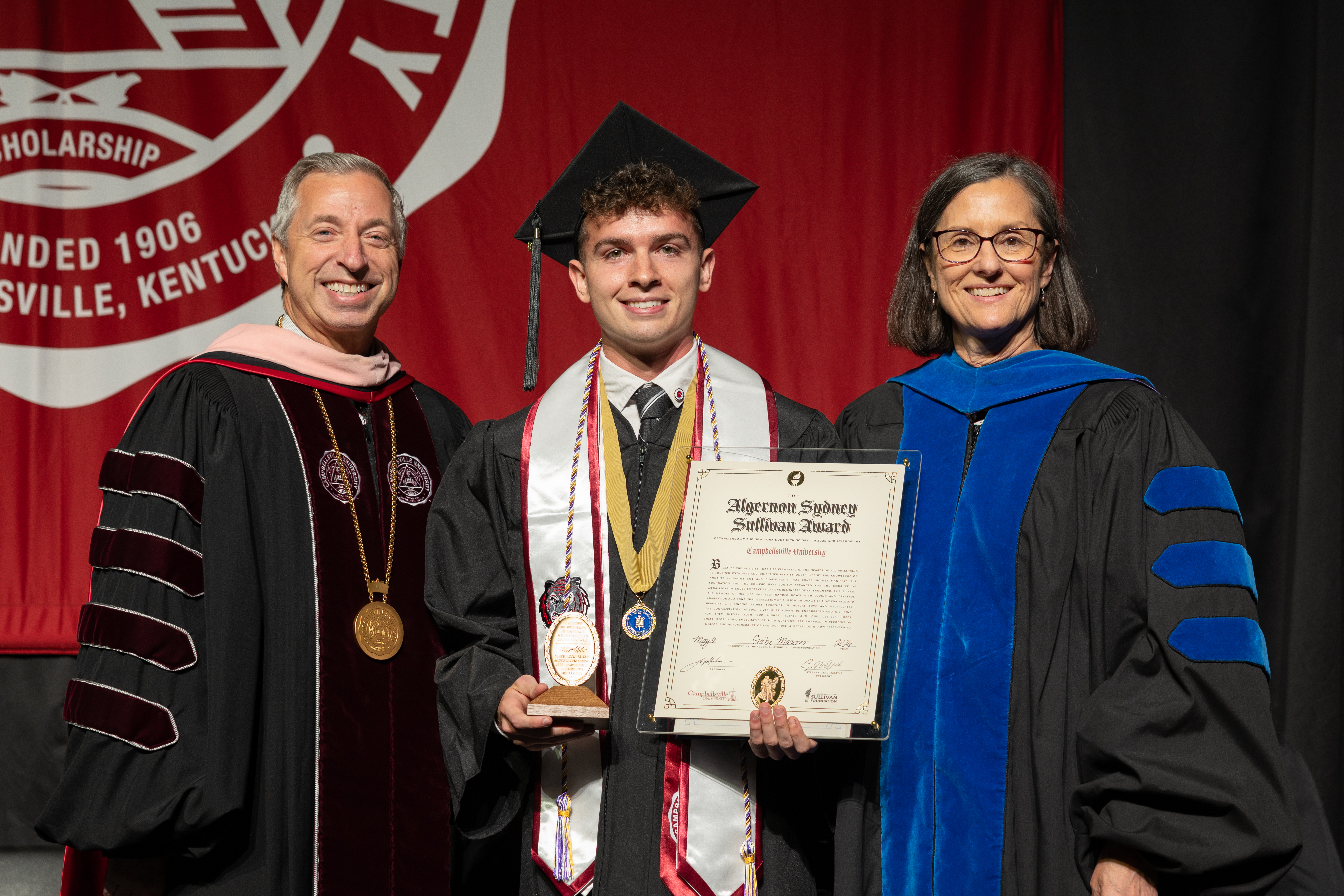 Class of 2026 graduate Gabe Maurer received the Algernon Sydney Sullivan Award from CU President Joseph Hopkins (left) and Provost Jeanette Parker (right)