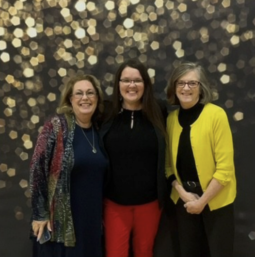 Three people posing for a photo
