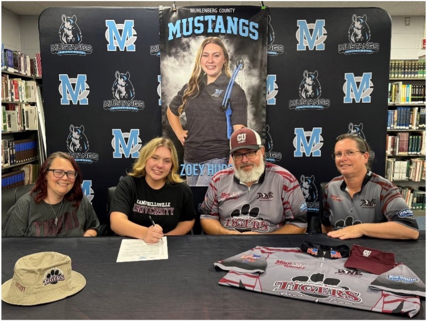 People posing at a table