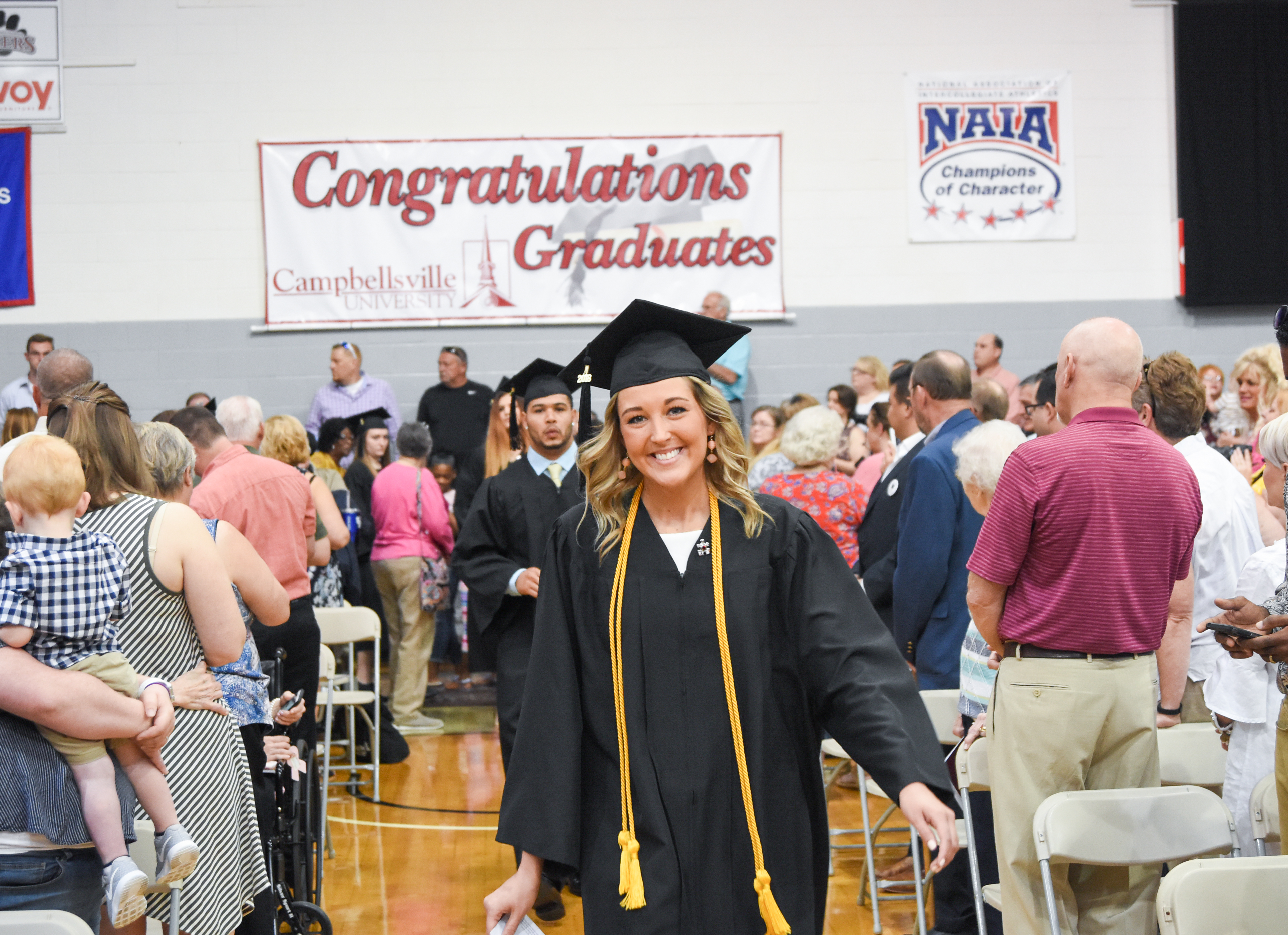 4333- Lindsey Browning of Lebanon, Ky., walks in during the 9 a.m. graduation ceremony in Powell Athletic Center. (Campbellsville University Photo by Joshua Williams)