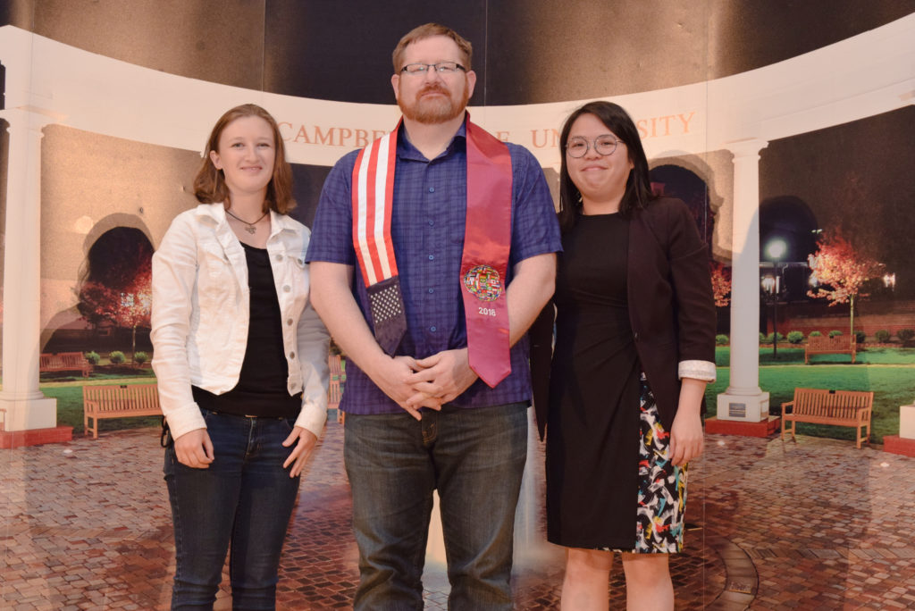 Dr. Shawn Williams, associate professor of political science, receives the Outstanding Center of International Education (CIE)/ESL Faculty Award, from Christina French and Elaine Tan, iarea ethnic and cultural studies instructor/facilitator. (Campbellsville University Photo by Andrea Burnside)