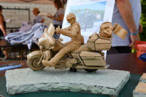 Road Warrior Rally raises funds for WWII statue modeled after Dr. E Bruce Heilman 1