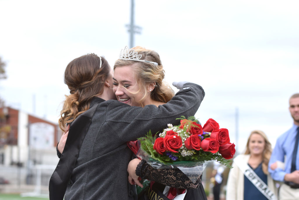 Jessica McCandless hugs the new queen, Rachel Mobley