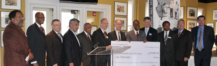 Administration from both Campbellsville University and Simmons College of Kentucky were at the check presentation of $20,000 from The Gheens Foundation for “CU 360” technology. From left are: the Rev. J. Ronald Sams, executive vice president at Simmons College of Kentucky; the Rev. Frank Smith, executive vice president at Simmons; the Rev. John Chowning, vice president for church and external relations and executive assistant to the president at Campbellsville University; Guy Montgomery of Louisville, member of the CU Board of Trustees; Dr. Johnnie Clark of Louisville, board member of Simmons College of Kentucky and Campbellsville University; Dr. Michael V. Carter, president of Campbellsville University; Carl M. Thomas, executive director The Gheens Foundation Inc.; Dr. Kevin W. Cosby, president of Simmons College of Kentucky; Bill Lamb, president and general manager of WDRB-TV in Louisville; Dr. Brian Wells, vice president of academic affairs at Simmons; Dr. Keith Spears, vice president for regional and professional education at Campbellsville University; and Benji Kelly, vice president for development at Campbellsville University. (Campbellsville University Photo by Linda Waggener)
