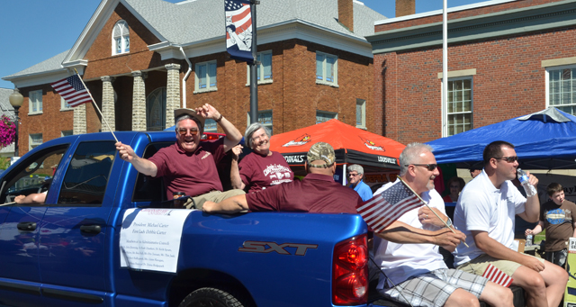 Members of the CU Administrative Council ride in the back of CU president Michael Carter's truck  in the July 4th parade in downtown Campbellsville. From left are back Dr. Keith Spears and Ginny  Flanagan with Rusty Hollingsworth in center and Dave Walters and Benji Kelly in front. Otto Tennant drove the truck with Dr. Frank Cheatham inside. (Campbellsville University Photo by Joan C. McKinney)