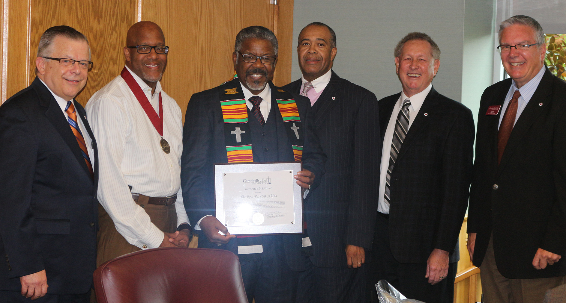 Campbellsville University's Kente Cloth award was presented to Dr. C.B. Akins, Sr., pastor of First Baptist Church Bracktown in Lexington, Ky. and moderator of the General Association of Baptists in Kentucky, for his servant leadership. From left: Dr. John Chowning, vice president for Church and External Relations and executive assistant to the president; Dr. Stephen J. Thurston, senior pastor of New Covenant Missionary Baptist Church in Chicago, Ill.; Akins; Dr. Joseph Owens, chair of CU's Board of Trustees; Dr. Frank Cheatham, senior vice president for Academic Affairs; and Dr. Keith Spears, vice president for Graduate and Professional Studies. (Campbellsville University Photo by Drew Tucker)