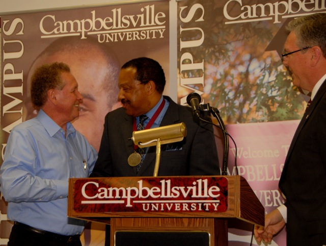 Al Cornish, Vice President for Norton Healthcare, was awarded Campbellsville University's Leadership Award for his national, state and local leadership in the field of healthcare. Dr. Frank Cheatham, left, Vice President for Academics at Campbellsville University, joined Dr. H. Keith Spears, at right, Vice President for Regional and Professional Education at CU, in presenting the medalat the annual Louisville Campus Graduate Celebration/Convocation, held May 22, 2009. (CU photo by Linda Waggener)