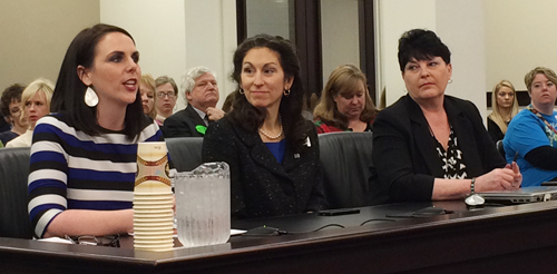 Ashli Watts, left, testifies before a legislative committee on a smoke-free  workplace law.