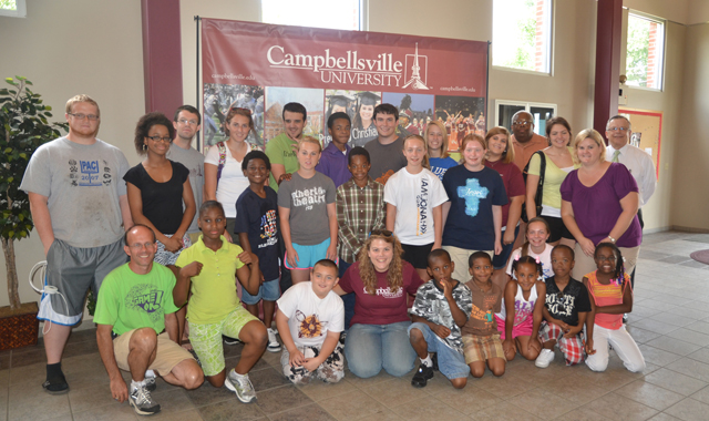 Campbellsville University hosted the Baptist Fellowship Center (BFC) from Louisville July 11 as part of the BFC’s summer enrichment program. Students from BFC and Campbellsville University pose for a group picture. From left are: Front row – Rusty Watkins, CU coordinator of summer camps and conferences; BFC student Shantel Walton; BFC student James Thompson; CU student Maribeth Milburn; BFC students Anthony Jackson; Josiah Finley; Makayla Conn; Rashad Reed and Jurni Woodson. Second row – CU student Shane Williamson; CU student Christian Malcomson; BFC student Virgil Jackson; CU student Kimbra Compton; BFC students Donovon Armstead; Mallory Stone, Raegan Stone; BFC student Cecile Stone (crouching); and BFC Jammie Stone. Back row – CU student Scott Blakeman; BFC Hannah Landgrave; CU student Mitchell Monroe; BFC student Breon Armstead; CU student Matt Macon; CU student Mary Kate Young; CU student Ashley Buchanan; the Rev. Matt Smyzer, executive director of Baptist Fellowship Center; BFC Reagan Jones; and John Chowning, CU vice president for church and external relations and executive assistant to the president. (Campbellsville University Photo by Joan C. McKinney)