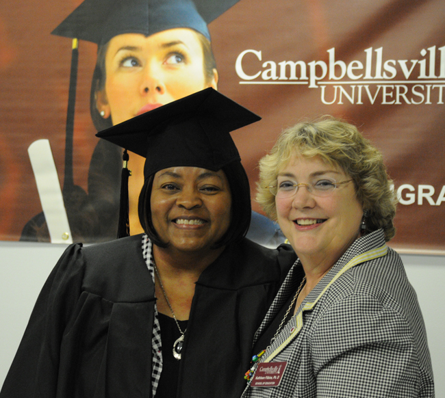 CU-Louisville graduate, Barbara Ellery, at left, completed her degree in early childhood education. Dr. Kathleen Filkins, at right, the education program coordinator at the Louisville Center, said, “Barbara has worked her classes in as life has allowed and never given up. I am very proud of her.” Filkins said that Ellery has also been a dynamic encourager of others while she has been going to school, and is part of the reason the Louisville Center ECE program is enjoying explosive growth. (Campellsville University Photo by Linda Waggener)