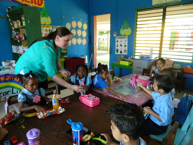 Rebecca Kimber, left, of Leitchfield, Ky., works with children on the Belize mission trip. Kimber is transferring to CU studying interdisciplinary early childhood education. (Campbellsville University Photo by Victoria Hundley)