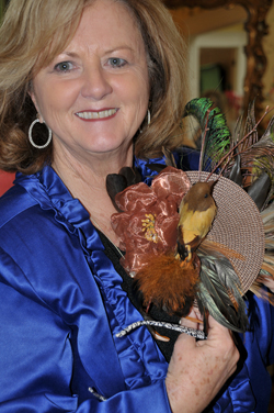 Betty Hord-Johnston, a member of the  Advancement Board, selected a hat at the Derby Hat Preview event. She is part of  the leadership and planning of the annual  Derby Rose Gala. (Campbellsville  University Photo by Linda Waggener)