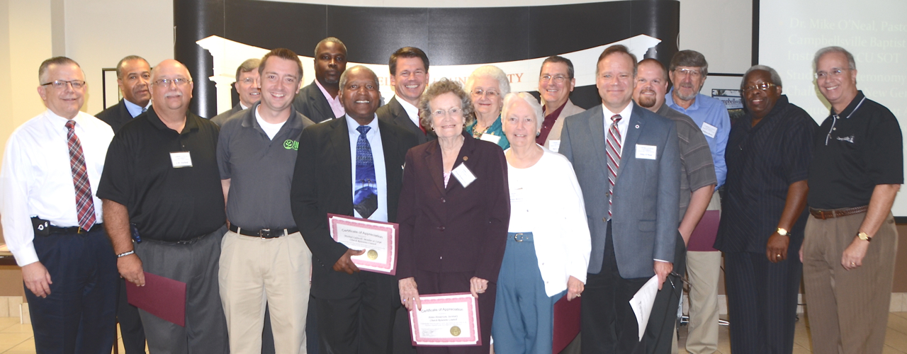 Certificates were given to CU Church Relations Council members who have served on the Executive Committee, thanking them for their service to the Church Relations Council.From left, front row – Dr. John Chowning, the Rev. J.W. Hatfield, the Rev. Kenny Rager, the Rev. Michael Caldwell, Mrs. Helen Henderson and Mrs. Grace Gristow and Dr. Mike O’Neal. From left, back row – Dr. Joseph L. Owens, the Rev. Bill Patterson, the Rev. David Cozart, Dr. Joel Carwile, Mrs. Anna Mary Byrdwell, the Rev. Steve Sholar, the Rev. Kyle Franklin, the Rev. Wilburn Bonta, the Rev. Matthew Smyzer and CU President Michael V. Carter. ( Campbellsville University Photo by Linda Waggener)