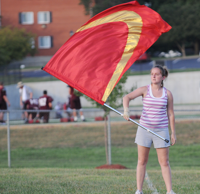 Carla Edmondson of Independence, Ky. twirls a flag as a part of the color guard in Campbellsville University’s Tiger Marching Band. (Campbellsville University Photo by Richard RoBards)