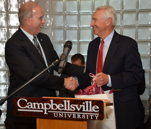 Dr. Michael V. Carter, president of Campbellsville University, presents a gift to Ky. Gov. Steve  Beshear during his visit to Campbellsville June 10.