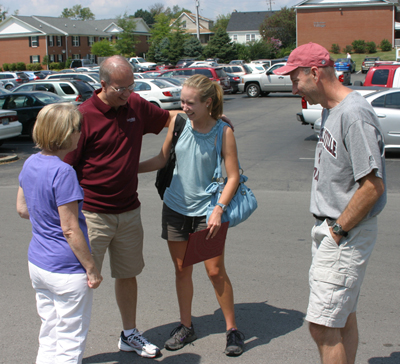Dr. Michael V. Carter, second from left, president of Campbellsville University, greets Savannah Workman, a freshman from Fort Gay, W.Va., and her father. First Lady Debbie Carter is at far left.  (Campbellsville University Photo by Gerry James)