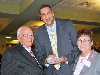 Charles and Sharon Hedrick smile with Sam Bowie as they receive his autograph. (Campbellsville  University Photo by Christina Kern)