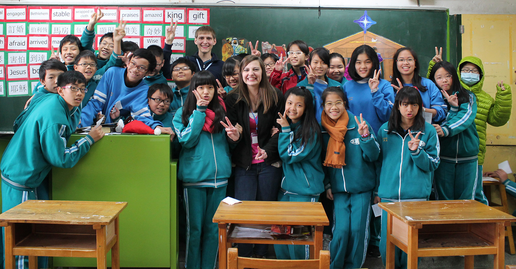 Taiwanese school children gather around CU students Jeremy Cheatham and Bethany Thomaston during their mission trip to Taipei, teaching them about the Nativity Story. (CU Photo provided by Bethany Thomaston)
