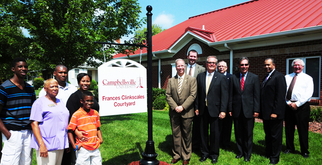 Members of Frances Clinkscales’ family, at left, pose with those from Campbellsville University at the courtyard dedication. From left are: Back row – Quentin Goodin, great-grandson; and Chris Goodin, son-in-law. Front row – Lavada Goodin, niece; LaQuita Goodin, niece, who spoke on behalf of the family, and Tre Goodin, great-grandson; and at right, from left, Front row – Dr. Michael V. Carter, president; and Campbellsville Mayor Tony Young. Back row – Benji Kelly, vice president for development; John Chowning, vice president for church and external relations and executive assistant to the president; Ron Lewis, member of the CU Board of Trustees and former U.S. representative, (R-Ky.); Dr. Joseph Owens, chair of the CU Board of Trustees; and Taylor County Judge-Executive Eddie Rogers. (Campbellsville University Photo by Ellie McKinley)