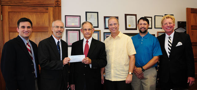 Columbia Baptist Church staff present a $1,500 check to Campbellsville University School of Theology to cover costs of printing the school’s book, “Producing World Changers for Christ.” From left are: Dr. Shane Garrison, assistant professor of educational ministries; Dr. John Hurtgen, dean of the School of Theology and professor; Darrell Overstreet, chairman of the budget committee at Columbia Baptist Church; Dr. Michael V. Carter, president of CU; Daniel Marcum, youth minister at Columbia Baptist Church and a 1996 graduate of CU; and Dr. Ted Taylor, transitional pastor at Columbia Baptist and professor of Christian studies at CU. (Campbellsville University Photo by Christina Kern)
