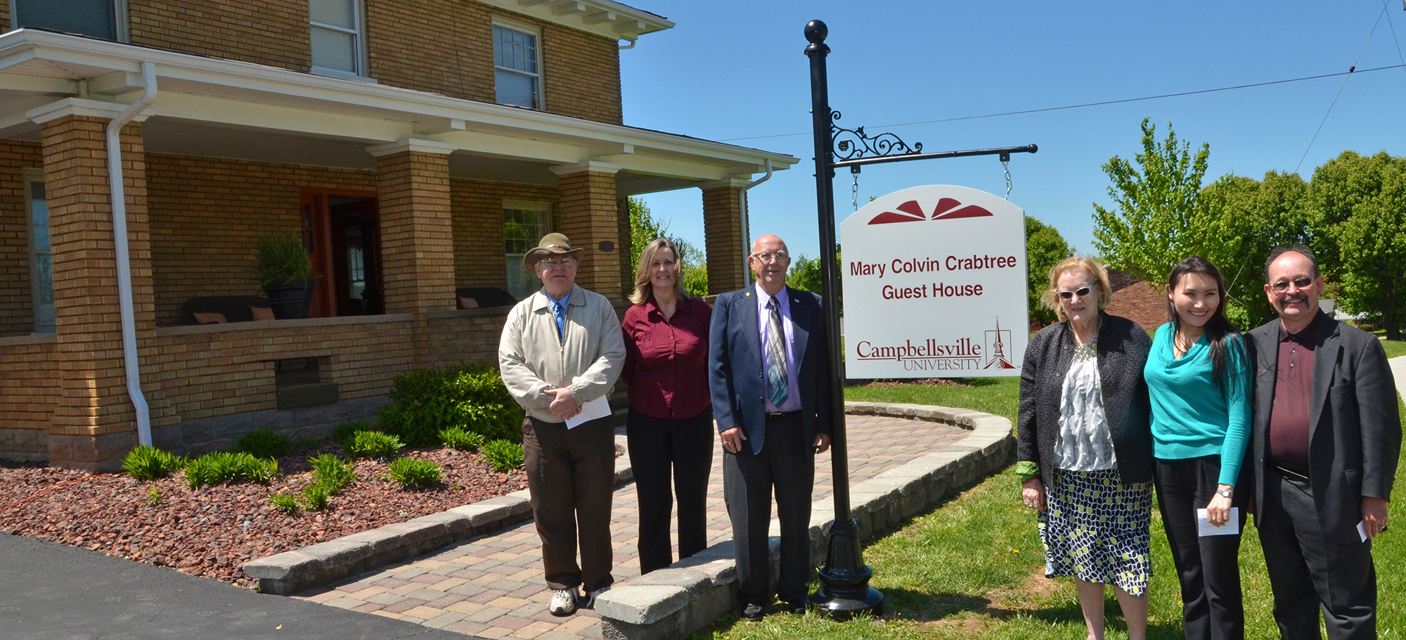 Everett and Rose Colvin stand in front of the new "Mary Colvin Crabtree Guest House," which is named in honor or their late daugther. 