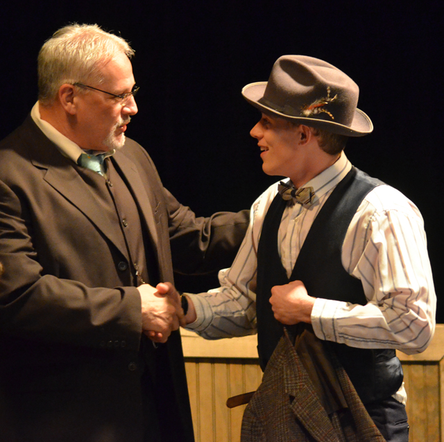 Dave Walters, left, vice president for admissions and student services, shakes hands with Tyler  Litton, who plays George Bailey in "It's a Wonderful Life." (CKNJ Photo by Calen McKinney)
