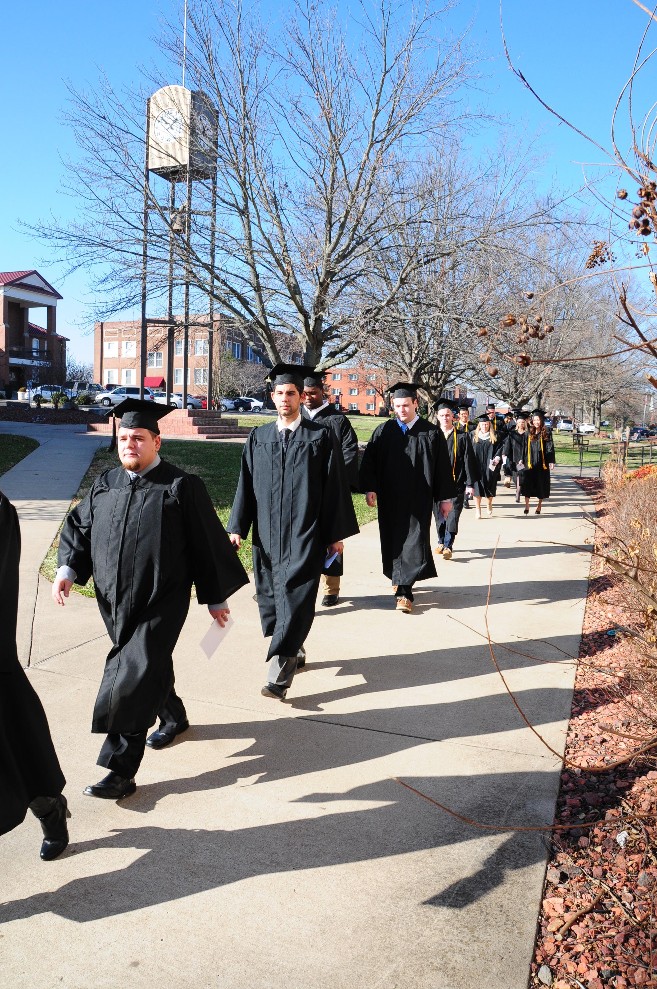  Graduates performing the ceremonial walk around  campus. (Campbellsville University Photo by Kyle  Perkins)