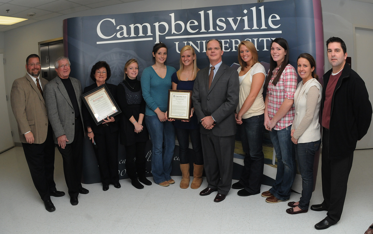 Congressman Brett Guthrie, Campbellville Mayor Brenda Allen and Taylor County Judge Executive Eddie Rogers presented special recognitions to the Campbellsville University women’s volleyball team Friday. Shown are: (L-R) Campbellsville Athletic Director Rusty Hollingsworth, Rogers, Allen, CU players Caitlin Dresing, Whitney Haynes, Shannon Cahill, Guthrie, CU players Brooke Marcum and Samantha James, and coaches Amy Eckenfels and Randy LeBleu. (Photo Courtesy of Richard RoBards, Campbellsville University)