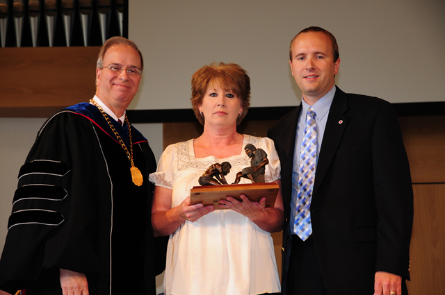 Donna Wilson, center, was the recipient of the staff Servant Leadership Award at Campbellsville University recently. She is with Dr. Michael V. Carter, president, and Tim Judd, comptroller. (Campbellsville University Photo by Ashley Wilson)