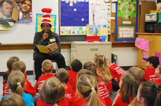 Dr. Colleen Walker, assistant professor of education, puts expression in her reading to children at Taylor County Elementary School. (Campbellsville University Photo by Munkh-Amgalan Galsanjamts)