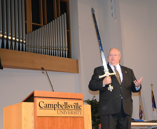 Dr. Floyd Paris, KBC president, uses a sword as a visual aid to display weaponry used by Israelite leaders in 1 Samuel. (Campbellsville University Photo by Naranchuluu Amarsanaa)