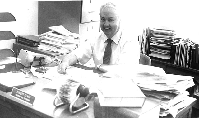 Dr. Robert S. Clark works at his desk in the Administration Building in the 1980s. (Campbellsville University Photo by Ayo Olaniyan)