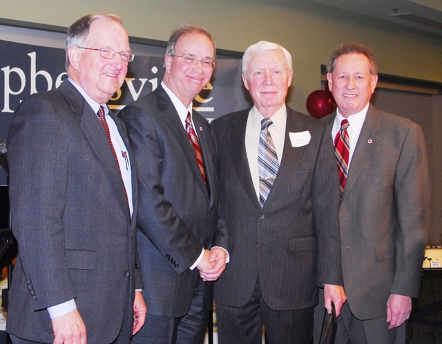 Dr. W. Morgan Patterson, second from right, is honored during Campbellsville University's Centennial Campaign Celebration Dinner. Patterson is pictured with, from left, Dr. Jay Conner, chair of CU's Board of Trustees, Dr. Michael V. Carter, president, and Dr. Frank Cheatham, vice president for academic affairs. (Campbellsville University photo by Joan C. McKinney)
