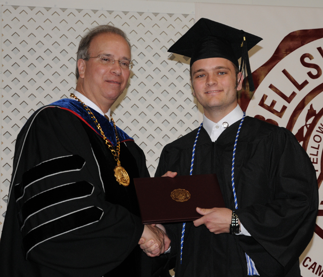 Dustin Ford of Campbellsville receives his associate degree in nursing at the undergraduate ceremony May 14 in Powell Athletic Center. (Campbellsville University Photo by Joan C. McKinney). 