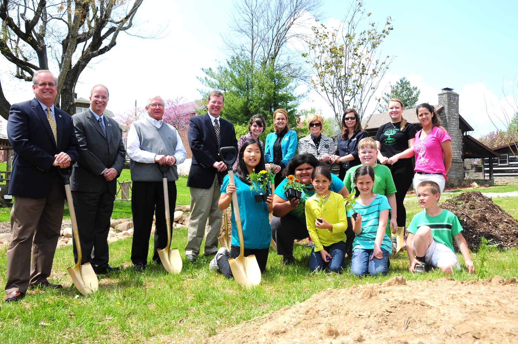 The planting kicked off at CU’s Earth Day 2014 celebration April 22. From left, standing, are Campbellsville Mayor Tony Young, CU president Dr. Michael V. Carter, Taylor County Judge Eddie Rogers, guest speaker Dr. Matthew Sleeth, SGA president Jacqueline Nelson, LG&E KU representatives Rhonda Rose, Gidget Stubbs and Tiffany Cox, and Green Minds student representatives Constanze Sophie Mälzer and Ana Gonzalez. In the front row, from left, are visitors Yoonseo Nam; Yunisha Richerson, Kaylynn Smith, Sarah Adkins, Blake Settle behind Sarah, and Caiden Yocom. (CU Photo by Ye Wei "Vicky")