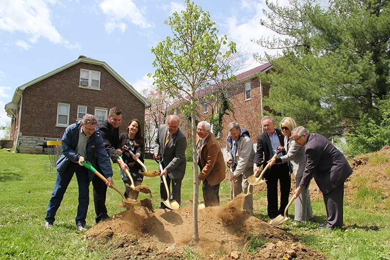 As part of Campbellsville University's Earth Day celebration, a new tree was planted in Turner Log Cabin Park by those who participated in the event. From left, are: Dr. Richie Kessler, environmental studies program coordinator and chair of the Kentucky Heritage Land Conservation Fund, Michael Jennings, GPA president, Constanze Malzer, Green Minds president, Campbellsville Mayor Tony Young, Taylor County Judge/Executive Eddie Rogers, George Howell, a principal donor of Clay Hill Memorial Forest, Dr. Frank Cheatham, senior vice president for academic affairs, Carla Goldsmith, retail operations manager at Kentucky Utilities, and Dr. John Chowning, vice president for church and external relations and executive assistant to the president. (Campbellsville University Photo by Rachel DeCoursey)