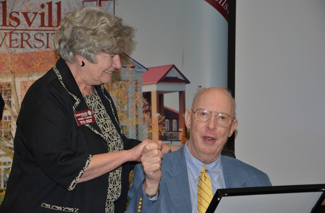 Ginny Flanagan, left, part-time special assistant to the president at Campbellsville University,  congratulates Ed McGuire on the Distinguished Service Award he received from CU.  (Campbellsville University Photo by Sarah Ames)