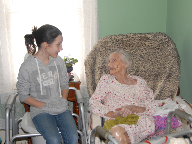 Elizabeth Rogers, left, wishes Lera Williams a happy birthday. They share the same birthday  100 years apart. Elizabeth turned 11 on Feb. 9, and Lera turned 111. (Campbellsville University  Photo by Emily Campbell)