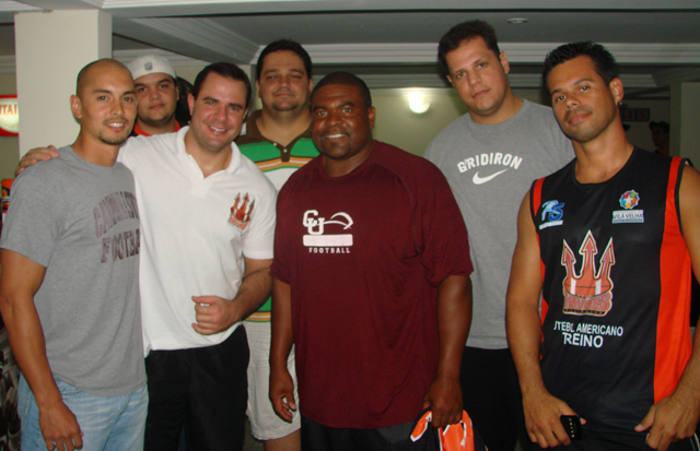 Campbellsville University assistant coach Rick Gehres, left, and head coach Perry Thomas, center,  pose for a photo with members of the Vila Velha Tritons. (Photo by Guido Nunes)