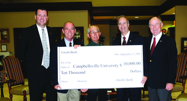 Leroy Bratcher, second from left, market president at the Campbellsville Forcht Bank, presents a $10,000 check to Campbellsville University’s Dr. Michael V. Carter, third from left, president. At far left is Benji Kelly, vice president for development. Beside Bratcher is Paul Osborne, a member of the bank’s board of directors. At far right is Chuck Vaughn, director of the Big Maroon Club and centennial campaign officer for major gifts. (Campbellsville University Photo by Rachel Crenshaw)