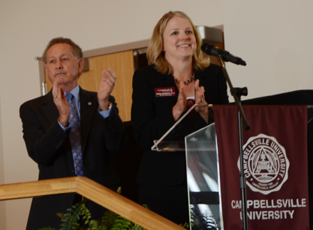 Dr. Frank Cheatham, left, and Dr. Donna Hedgepath applaud the  award recipients. (Campbellsville University Photo by Linda  Waggener)