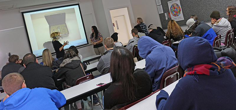 Spanish artist Eva Grande speaks to Campbellsville University students during her "Artist Talk." Here, she is speaking about the texture she used in her piece and how it feels for the blind. (Campbellsville University Photo by Drew Tucker)