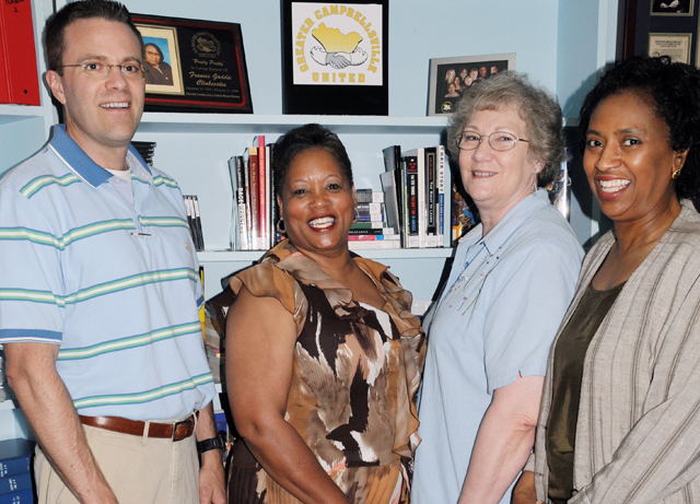 Greater Campbellsville United recently donated a resource library of diverse material to the Taylor County Public Library. Some of the individuals involved with the project are pictured, from left: Ron McMahan, executive director of Team Taylor County; Wanda Washington, coordinator of Greater Campbellsville United; Elaine Mundy, Taylor County librarian; and Diane Woods-Ayers, Campbellsville Independent Schools superintendent. (Campbellsville University Photo by Ashley Zsedenyi)