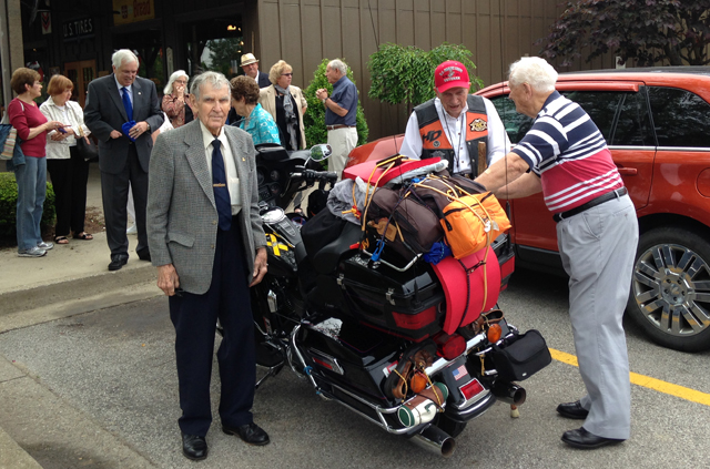 Dr. E. Bruce Heilman, center,  met with supporters at Cracker Barrel in LaGrange, Ky., as he  began his 10,000-mile journey by Harley-Davidson to Alaska. The Rev. Robert Oldham, a CU  graduate with Heilman, is at left wishing him well.