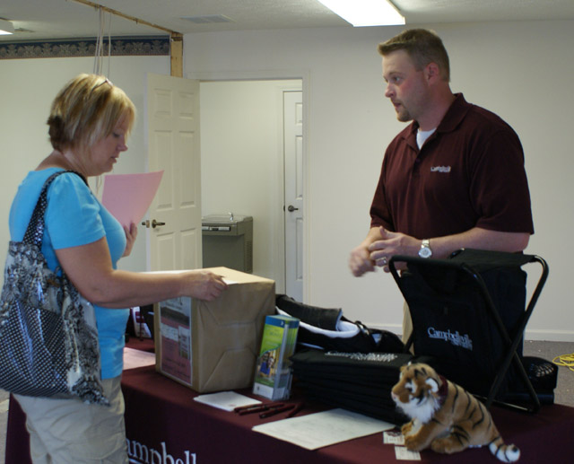 Vicky Fischel picked up information for her daughter, a student at On Fire Christian Academy from Campbellsville University admissions counselor John Ellis. (Photo Courtesty of Linda Ireland, LaRue County Herald News) 