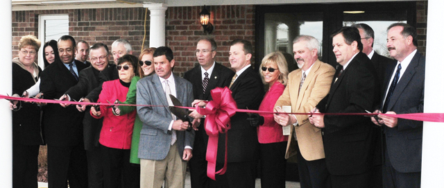From left, cutting the ribbon for the Brockman Center are: Dr. Laurice Rogers, instructor at Hodgenville; Tiffany Skaggs, student; Dr. Joe Owens, vice chair of the CU Board of Trustees; John Chowning, vice president for church and external relations and executive assistant to the president; Russell Brockman (Dr. Britt Brockman's father); Sue Brockman (Dr. Britt Brockman's mother); Dr. Britt and Paula Brockman’s daughter, Miche'la Minix; Freddie Hilpp;  Dr. Michael V. Carter, president of CU; Dr. Brockman; Paula Brockman, Dr. Brockman's wife; the Rev. Mike Rodgers, pastor of First Baptist Church-Hodgenville; LaRue County Judge Executive Tommy Turner; Dr. Keith Spears, vice president for regional and professional education, partially hidden; and Hodgenville Mayor Terry Cruse. (Campbellsville University Photo by Joan C. McKinney)