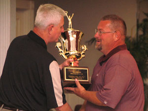 Rusty Hollingsworth, right, receives the MSC President's Cup from University of the Cumberlands AD Randy Vernon.