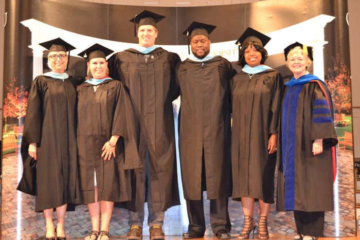 Students hooded during Campbellsville University’s School of Education Hooding Ceremony include from left: Ms. Norma Wheat, assistant professor of special education and chair of special education; Amanda Greer of Campbellsville, Ky.; Hunter Cantwell of Campbellsville, Ky.; Anthony Epps of Campbellsville, Ky.; Erika Tones of Fort Knox, Ky.; and Dr. Beverly Ennis, dean of the School of Education. (Campbellsville University Photo by Jordan Snider)