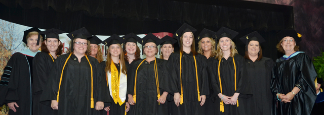 Students receiving their pins in the interdisciplinary early childhood education program are from left: Front row --  Paula Stinnett, Sarah Theimer, Misty Murray, Casey Dishman and Shelby Dean. Back row — Dr. Brenda Priddy, dean of the School of Education; Sara Parker, Candi Johnson, Whitney Burks, Amanda Greer, DeShay Dishman, Crystal Warren and Dr. Sharon Hundley, associate professor of education and chair of early childhood education. (Campbellsville University Photo by Joan C. McKinney)